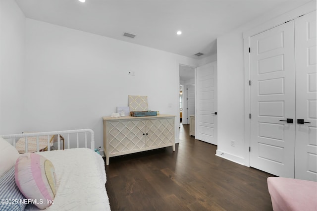 bedroom featuring dark wood-type flooring