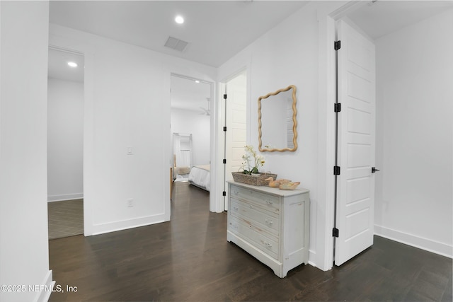 hallway featuring dark hardwood / wood-style floors