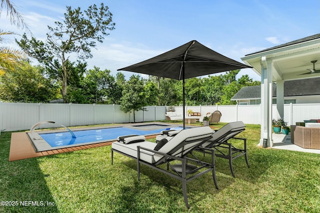 view of pool with a lawn and outdoor lounge area