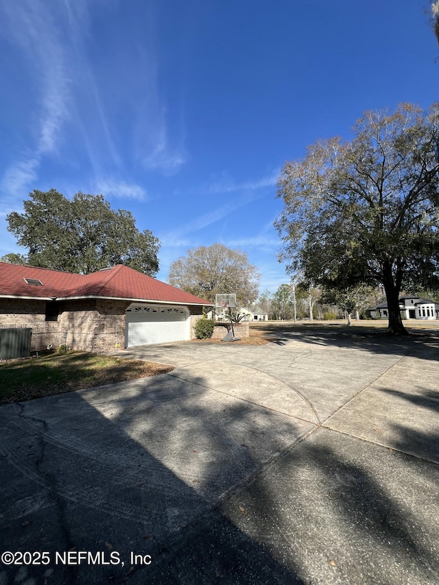 view of side of property with a garage