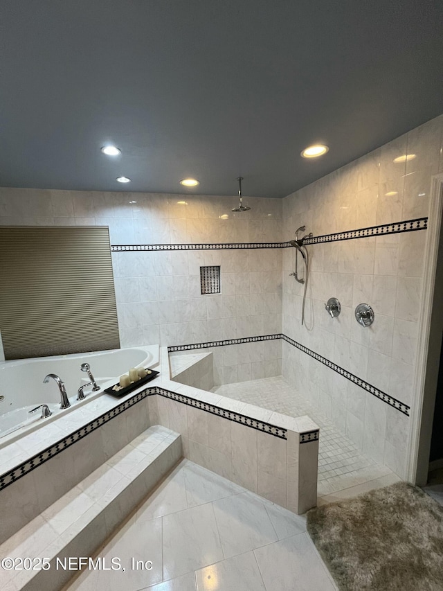 bathroom with shower with separate bathtub