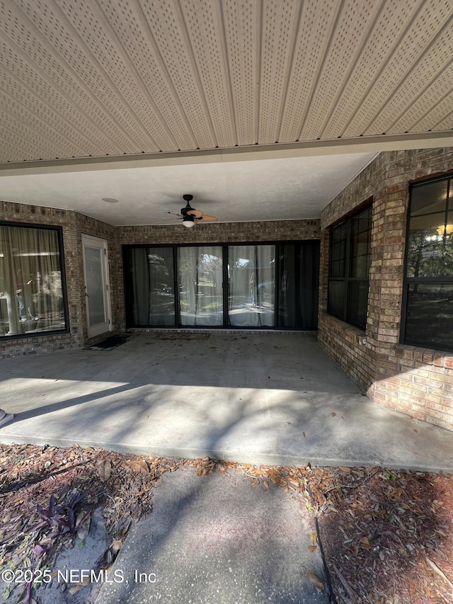 view of patio featuring ceiling fan