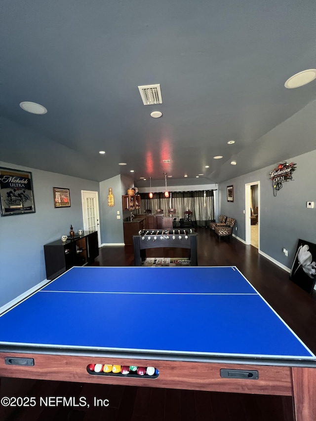 game room with wood-type flooring