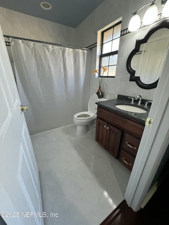 bathroom with toilet, tile walls, vanity, a shower with shower curtain, and backsplash