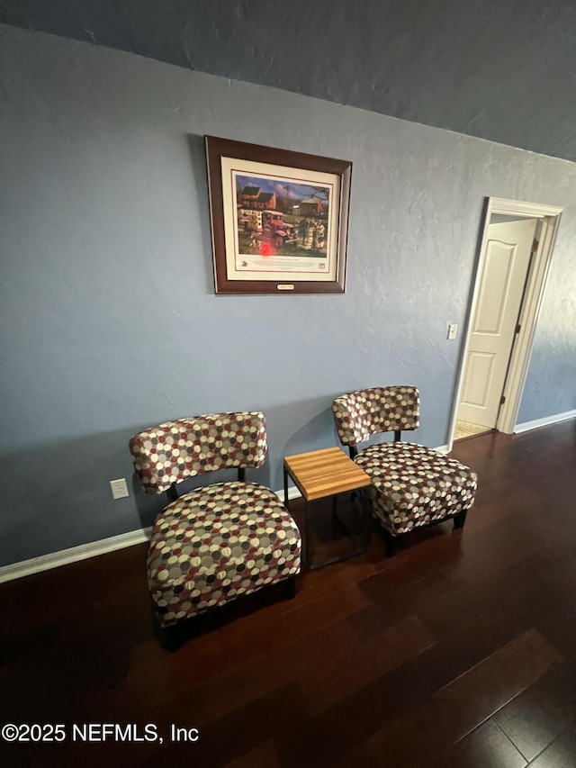 sitting room featuring dark hardwood / wood-style floors