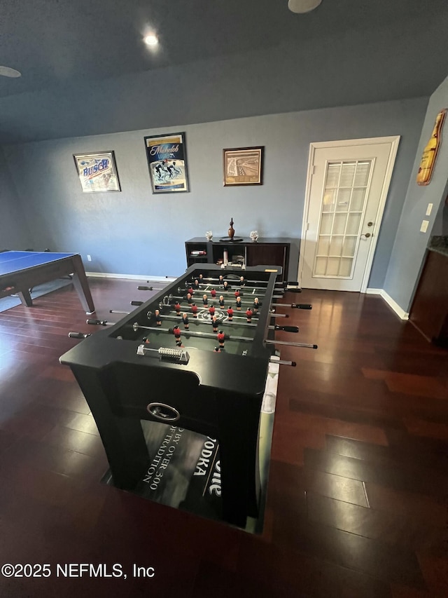 playroom featuring dark wood-type flooring