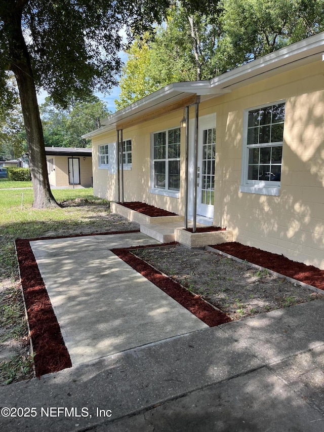 view of front of house with a patio area