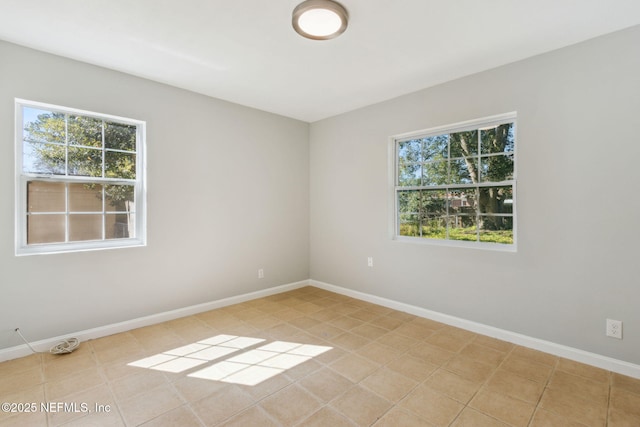 spare room featuring plenty of natural light