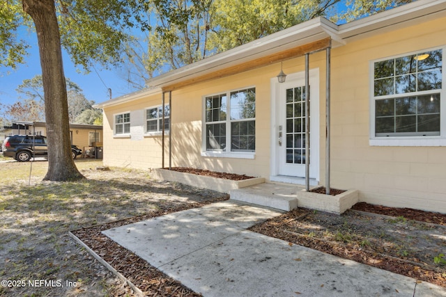 entrance to property featuring a patio area