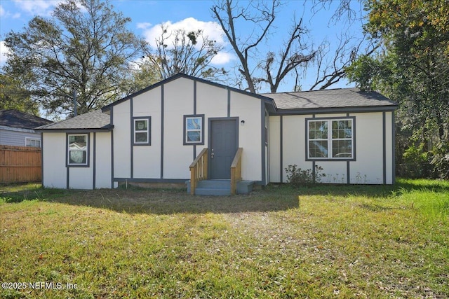 back of house featuring a yard