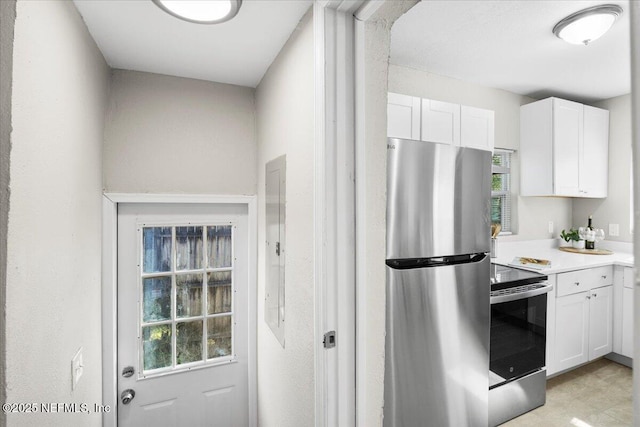 kitchen with white cabinetry and appliances with stainless steel finishes