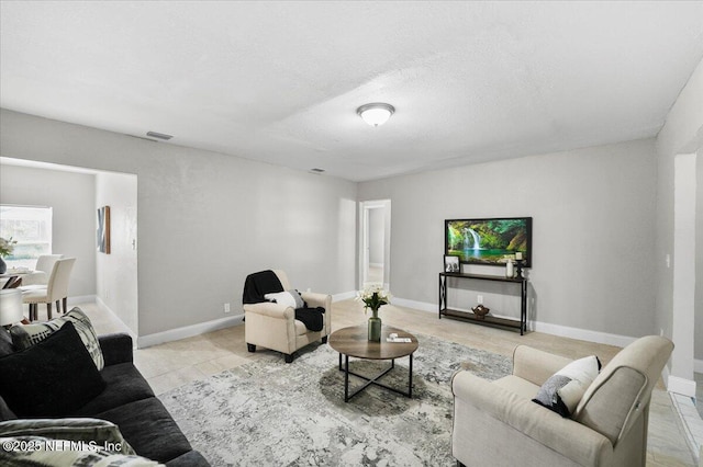 living room with a textured ceiling