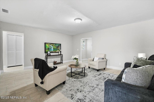 living room featuring a textured ceiling