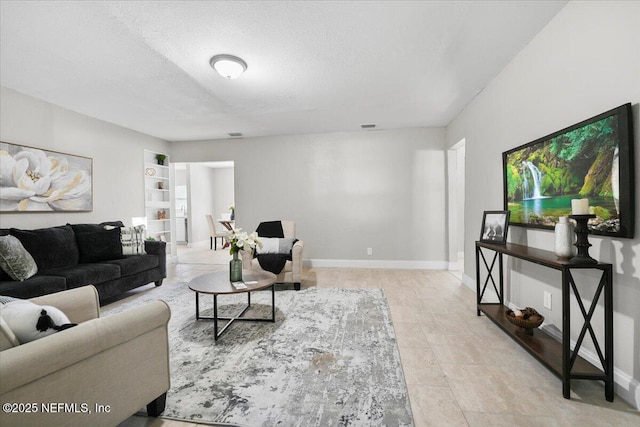 living room with a textured ceiling