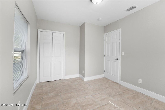 unfurnished bedroom featuring a closet