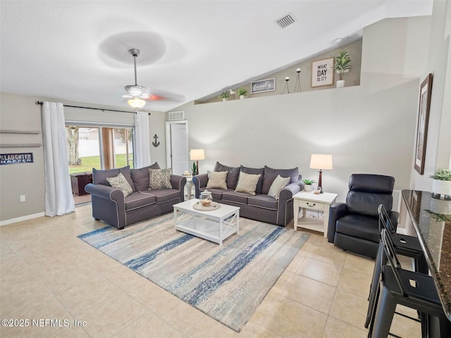 living room with vaulted ceiling, light tile patterned flooring, and ceiling fan