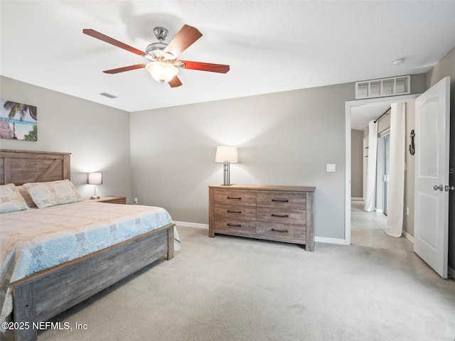 bedroom featuring ceiling fan and light colored carpet