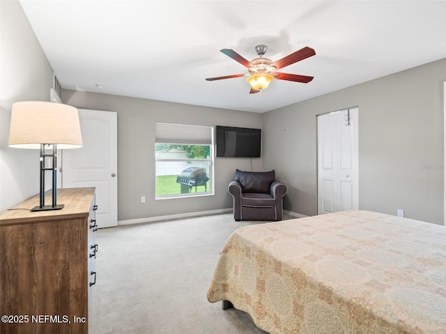 bedroom featuring light carpet and ceiling fan