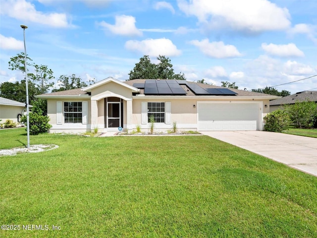 view of front of house with a garage and a front yard