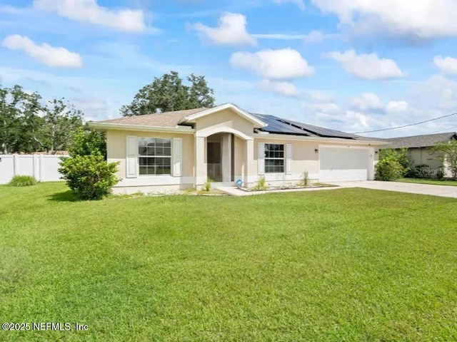 single story home with a garage, a front yard, and solar panels