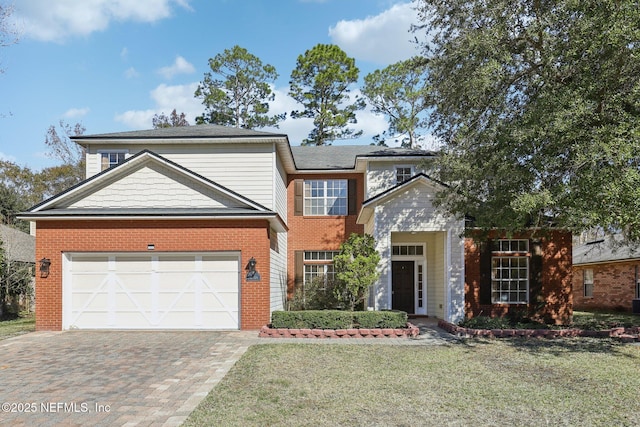 view of front of home featuring a garage and a front yard