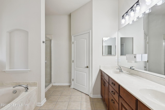 bathroom featuring vanity, tile patterned floors, and separate shower and tub