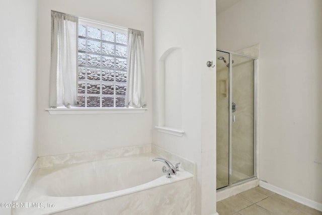 bathroom with tile patterned flooring and plus walk in shower