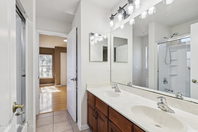 full bathroom with shower / bath combination with glass door, tile patterned floors, toilet, and vanity