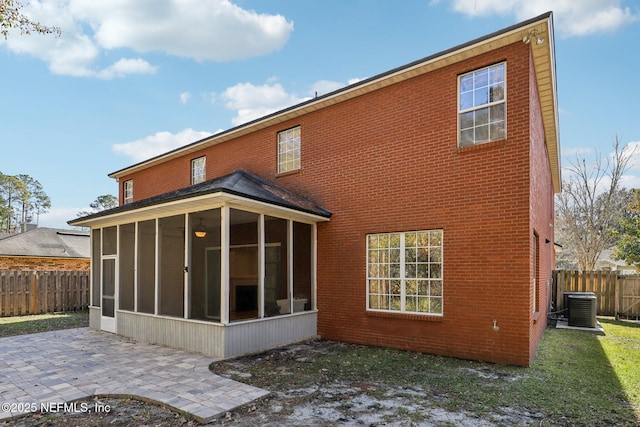 back of house with cooling unit, a patio, and a sunroom