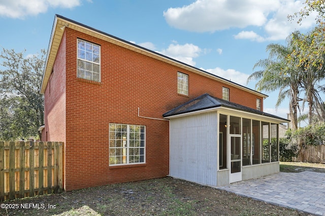 back of house with a patio and a sunroom