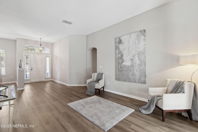 foyer with dark hardwood / wood-style flooring