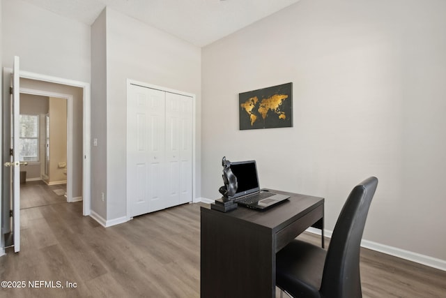 office with hardwood / wood-style flooring