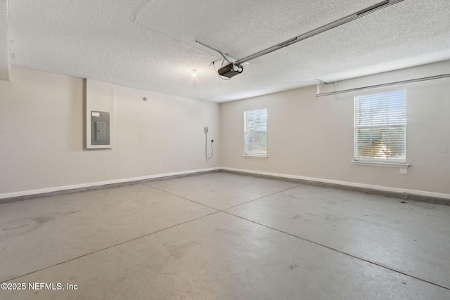 garage featuring a garage door opener and electric panel