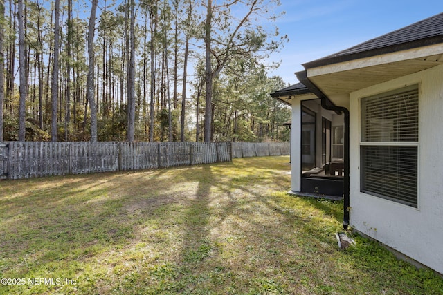 view of yard featuring a sunroom