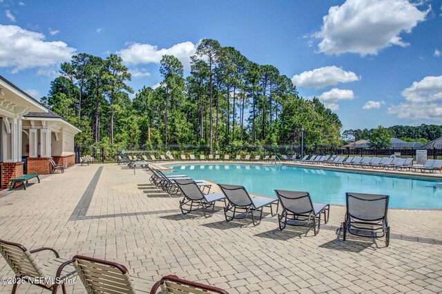 view of swimming pool featuring a patio