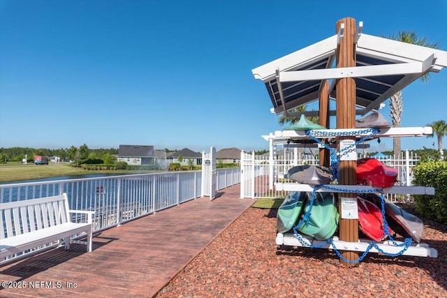 exterior space with a playground and a water view