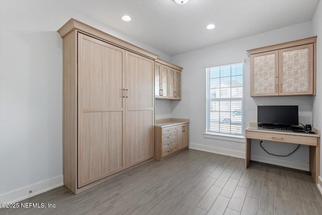 unfurnished office featuring light hardwood / wood-style flooring