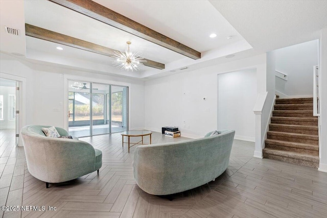 living room featuring a tray ceiling, beamed ceiling, an inviting chandelier, and light parquet flooring