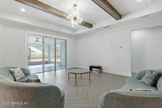 living room with parquet flooring, a chandelier, and beam ceiling