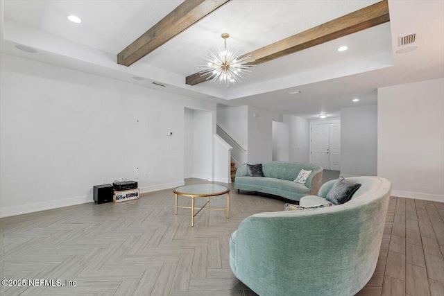 living room with an inviting chandelier, a tray ceiling, light parquet floors, and beam ceiling