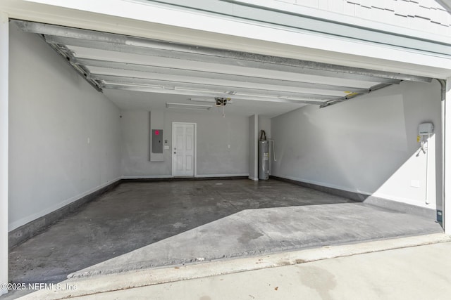 garage featuring a garage door opener, electric panel, and water heater