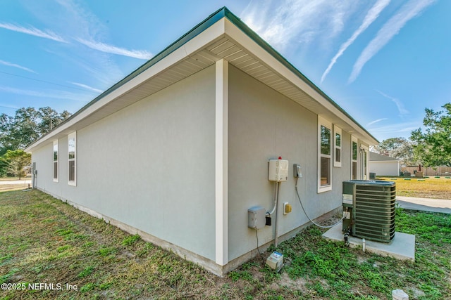 view of home's exterior featuring cooling unit