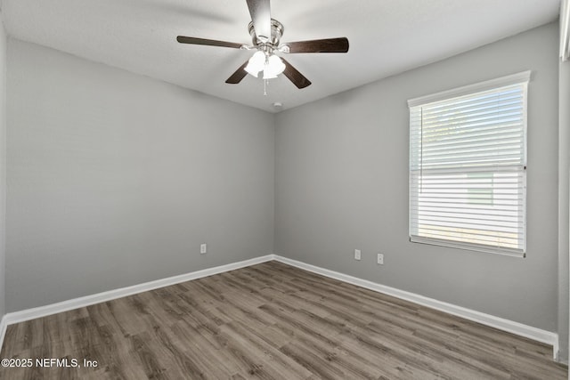 unfurnished room with hardwood / wood-style flooring and ceiling fan