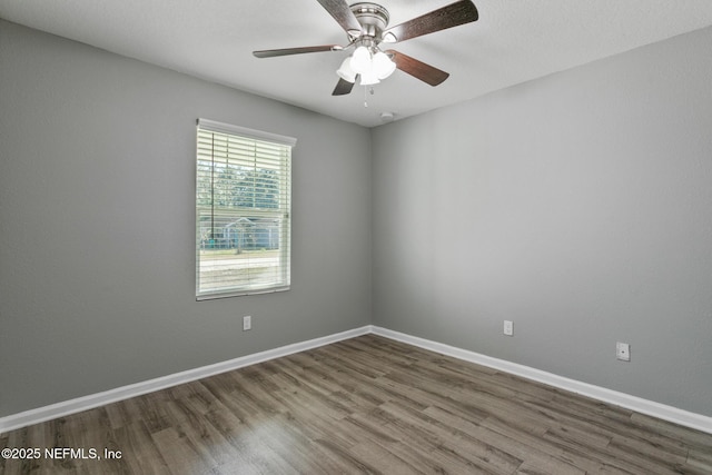 empty room featuring wood-type flooring and ceiling fan