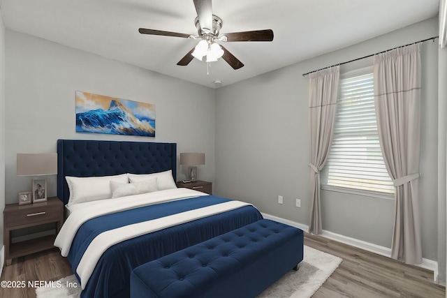 bedroom featuring hardwood / wood-style floors and ceiling fan