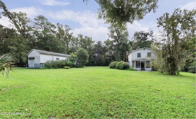 view of yard featuring a sunroom