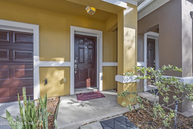 entrance to property featuring a garage