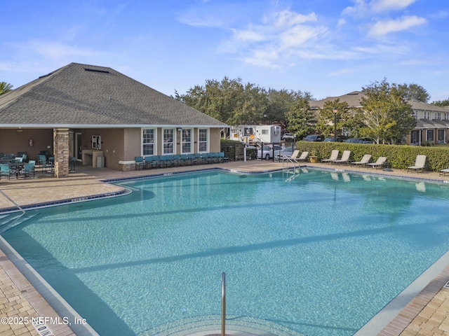 view of swimming pool featuring a patio