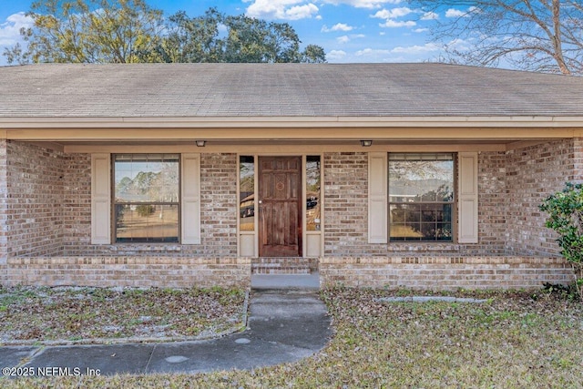 doorway to property featuring covered porch