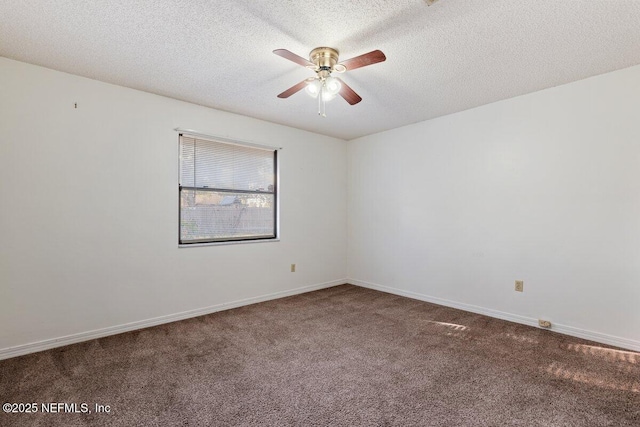 carpeted empty room featuring ceiling fan and a textured ceiling